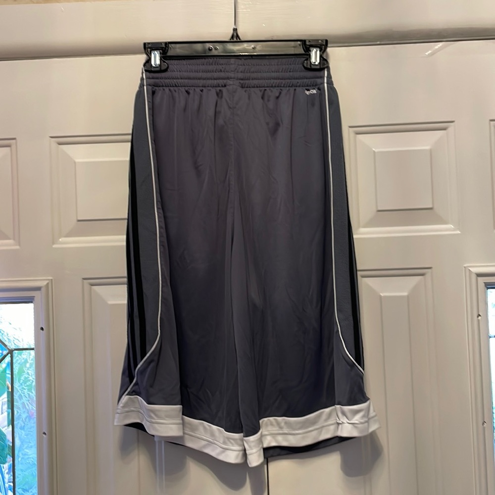 Adidas men’s shorts. Size small. Dark gray with three black stripes on the side.